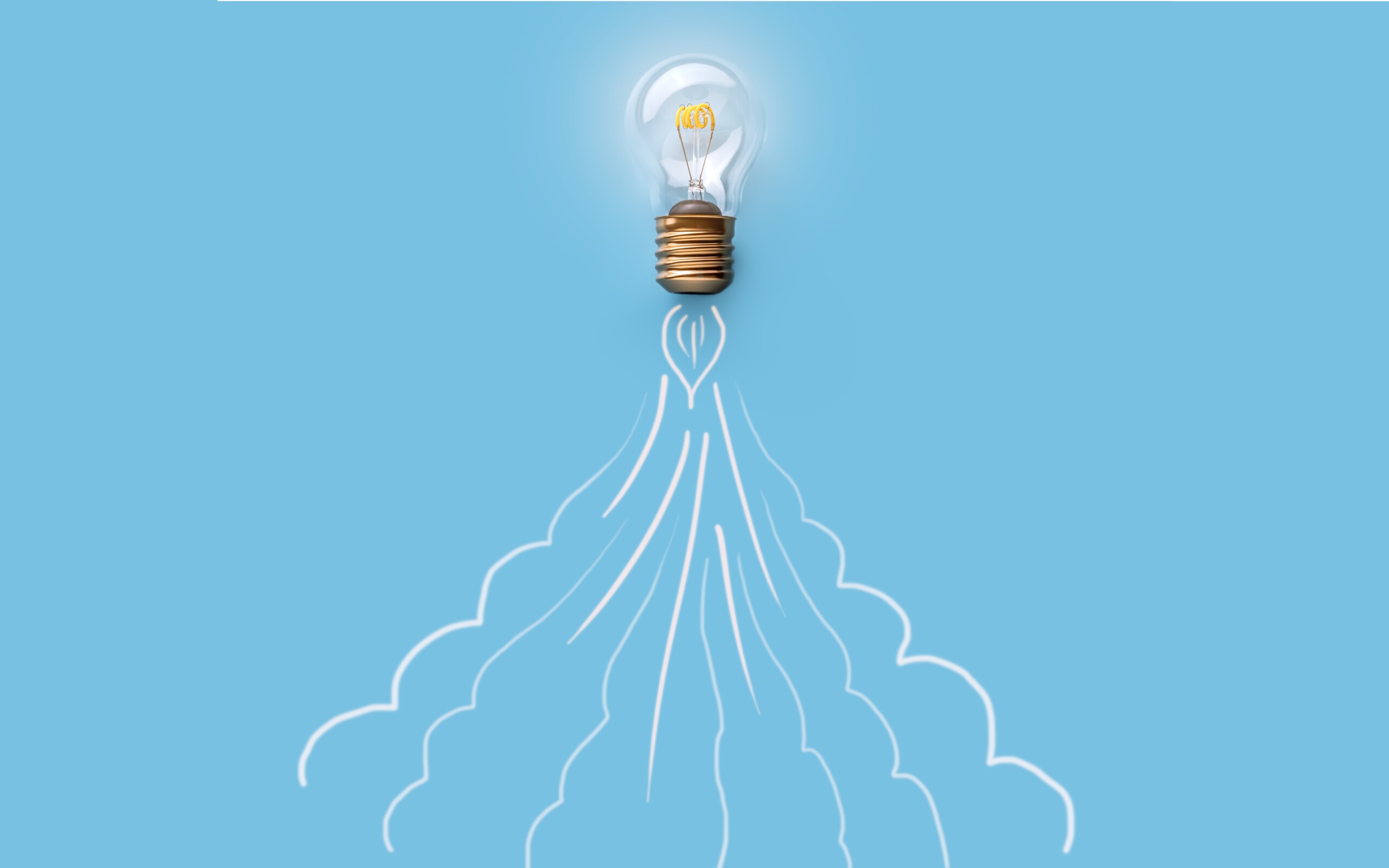 image représentant une fusée en plein décollage, avec une ampoule à son sommet.